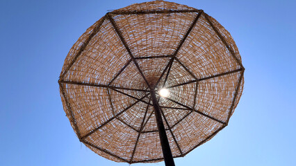 A beach umbrella is an indispensable accessory for a comfortable stay on the beach, protecting from direct sunlight and creating a cozy shade on the beach by the sea in hot weather.