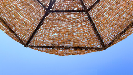 A beach umbrella is an indispensable accessory for a comfortable stay on the beach, protecting from direct sunlight and creating a cozy shade on the beach by the sea in hot weather.