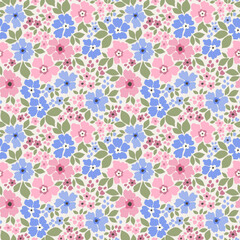 Beautiful floral pattern in small abstract flowers. Small light colorful flowers. White background. Ditsy print. Floral seamless background. Vintage template for fashion prints. Fashion print.