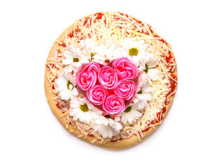 Pink roses in heart love shape and white chamomile flowers on top of a pizza and on white background. Abstract conceptual art. Selective focus.