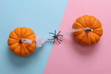 Halloween scene with pumpkins and spider web, holiday decor, top view