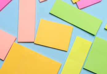Various blank paper multicolored stickers. Sticky note collection on blue background