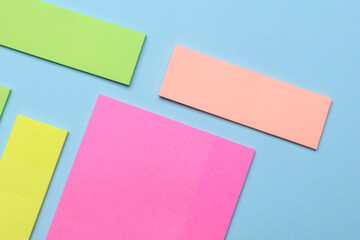 Various blank paper multicolored stickers. Sticky note collection on blue background