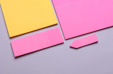 Various blank paper multicolored stickers. Sticky note collection on gray background