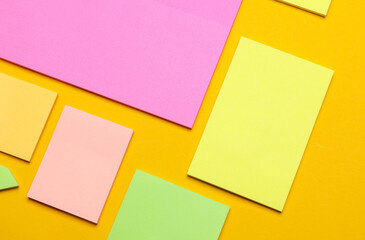 Various blank paper multicolored stickers. Sticky note collection on yellow background
