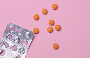 Empty blister and pills on pink background. Medicine, healthcare concept