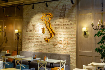 Map of Italy on the wall of a cozy Italian restaurant