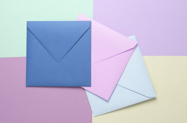 Group of colored envelopes on colored paper. Creative layout
