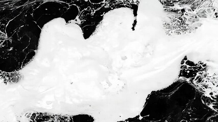 Dynamic white turbulence against a black background, creating an abstract space for impactful content.