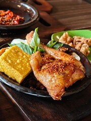 Traditional Indonesian fried chicken with coconut flakes