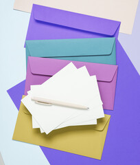 Set of colored envelopes with a white blank letter on a colored background