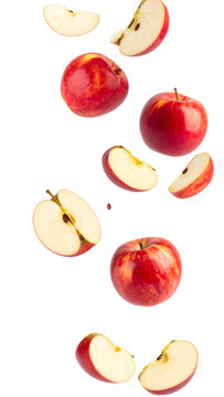 Fresh red apples and apple slices falling on transparent background