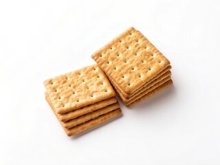 A stack of square, golden-brown crackers arranged neatly on a white background.