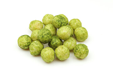 Pile of organic rice balls with spinach and leeks flavour. green millet snack