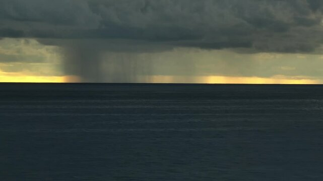 From above, the storm clouds over the ocean grow darker and more menacing, reflecting the rising frequency of extreme weather patterns driven by climate change.
