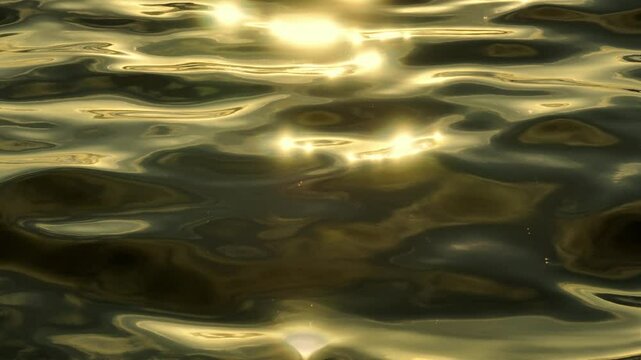The drone captures the ocean's surface glistening with golden reflections, where sunlight dances across the water, creating a shimmering, ethereal glow.
