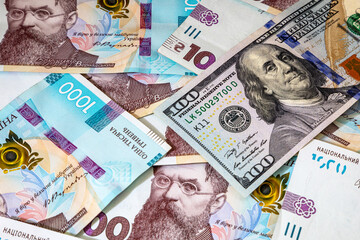 Background with Ukrainian money and American dollars