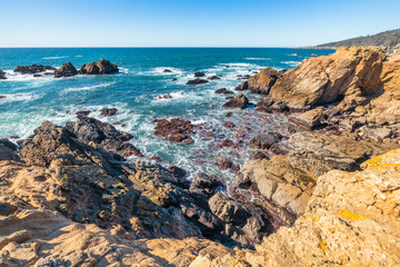 Coastal cliffs along California's Highway 1 in Northern California. Rugged ocean rocks, crashing...