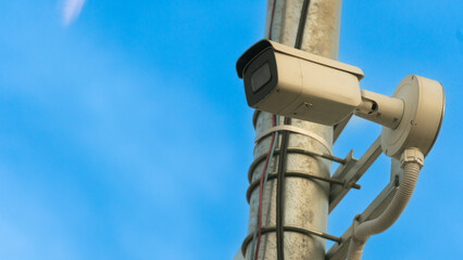 Obraz premium CCTV camera type outdoor install on the electric city. Camera install on the pole by steel on time 