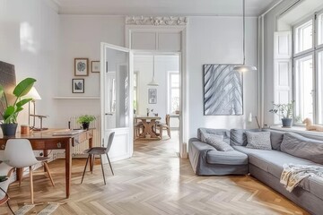  Scandinavian Modern Living Room with White Walls, Wooden Floor, Grey Sofa, and Minimalist Decor