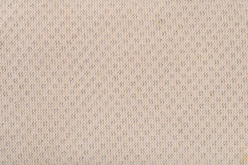 Closeup texture of back side of light brown laundry bag.