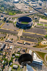 Visible wheel of airplane in aerial view of Denver football stadium