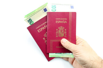 Spanish passports with 100 Euro banknotes.