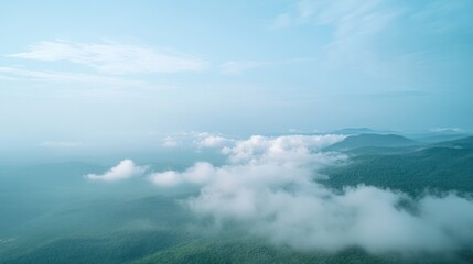 Fototapeta premium Aerial view of misty mountains, peaceful landscape, serene nature, travel background