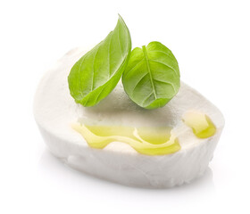 Mozzarella cheese with olive oil and basil leaves in closeup