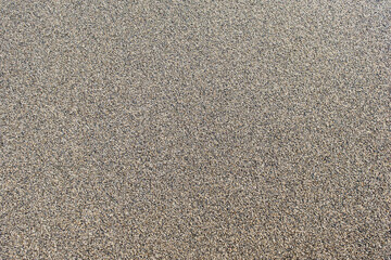 uniform background of beach sand, top view