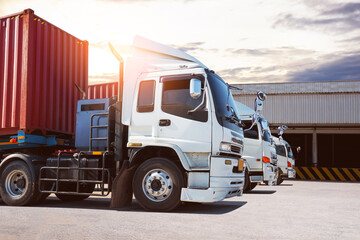 Semi Trailer Trucks on The Parking Lot at The Warehouse. Shipping Cargo Container. Trucks Loading Goods at Dock Warehouse. Distribution Warehouse. Big rig. Freight Logistics Truck Transportation.	

