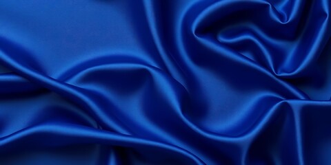 Fototapeta premium Elegant navy blue silk satin fabric with soft folds and wavy lines Background texture, stylish, folds