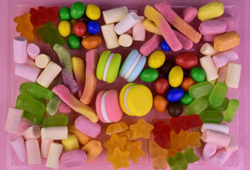 Background of many different candies. Flat lay.

