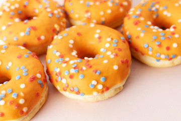 Orange donuts with sprinkles for King's Day celebration
