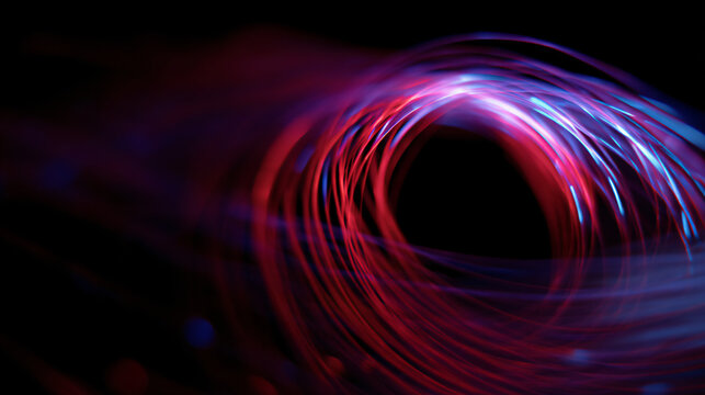 Vortex of light trails swirling in red, blue, and purple