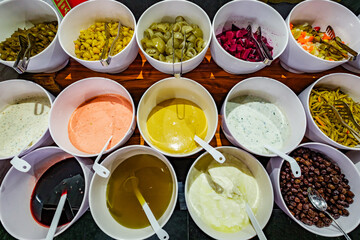 olives, oils, sauces on buffet table