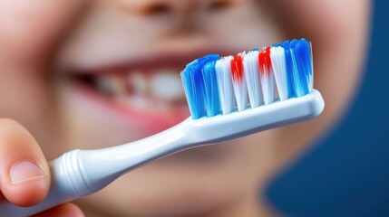 Happy child holding a colorful toothbrush for dental hygiene routine