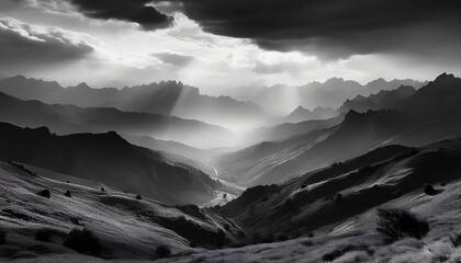 Obraz premium amazing landscape of mountains hills in sunbeam and cloudy sky in black and white shadow light monochrome style