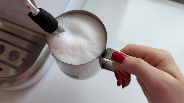 making coffee by frothing milk on a white table barista courses brewing coffee at home latte cappuccino