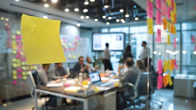 Team collaboration in modern office with brainstorming session and sticky notes