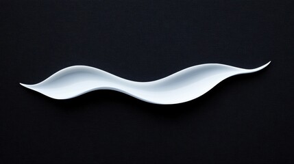 A white, abstract design on a black background.