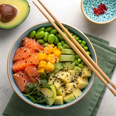 *Vibrant overhead shot of healthy poke bowl**, filled with salmon, avocado, edamame, mango, and sesame seeds, served with chopsticks.