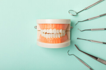 Dentist tools on a blue background. Dentist Concept.Teethcare, dental health concept. Means to care...