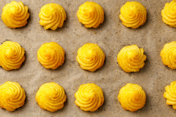 Duchess potatoes, mashed potatoes piped in decorative swirls