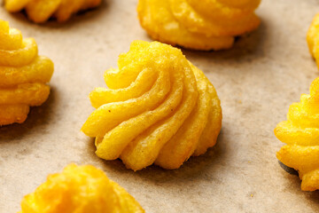 Duchess potatoes, mashed potatoes piped in decorative swirls