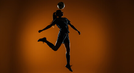  Silhouette of a Female Soccer Player Heading the Ball with Orange Background