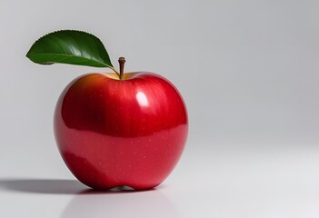 Fresh red apple with green leaf on a white background, showcasing vibrant color and natural shine, perfect for food, health, and nutrition concepts.