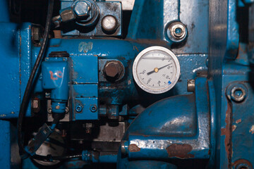 Part of a ship's propulsion system with a temperature gauge installed.