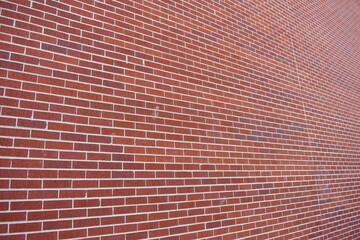Angled picture of red brick wall. Large County Hospital.