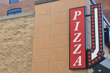 Pizza sign on local pizzeria.